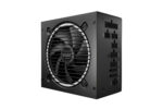 A black power supply unit with a large fan in the center and a black metal grill in front of it. The unit is shown from the side, with the back of the unit visible. The unit has a black metal casing and a large fan in the center. The fan has a black metal grill in front of it. The unit has a series of ports on the back, including USB ports, audio ports, and an HDMI port. The unit has a small LED light on the front that indicates its status.
