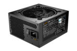 A black power supply unit with a round fan on top and a switch on the front, set against a white background.