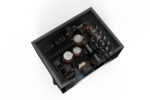 A 3D rendering of the inside of a power supply unit, showcasing its internal components and design.